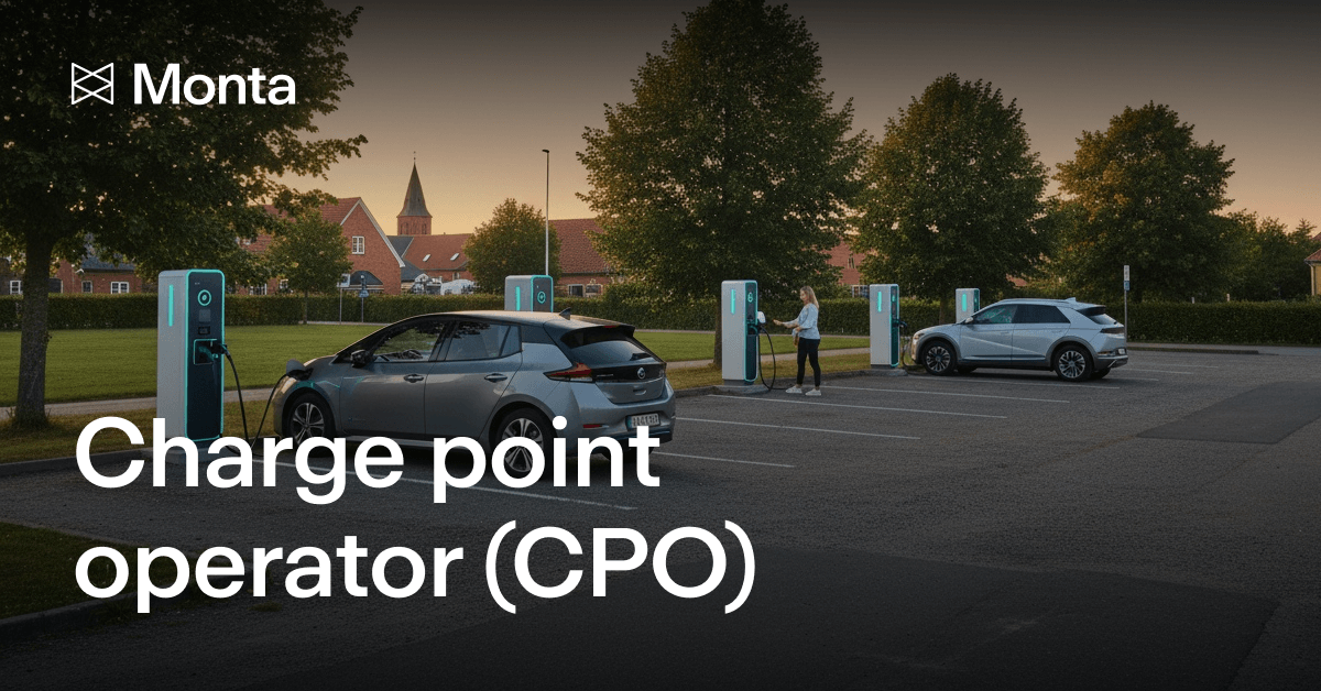 Two electric vehicles charging at a station with green charge points in a sunny, tree-lined parking area, featuring the Monta logo.