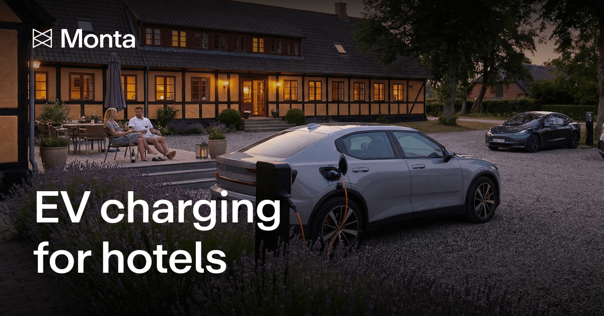 A modern electric vehicle charging at a hotel amidst a picturesque courtyard, with guests relaxing nearby in evening light.