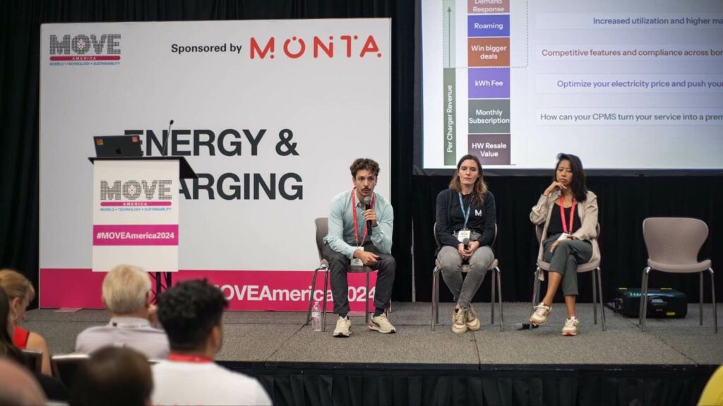 Three Monta product team members seated on stage for the profitability workshop, in front of a MOVE America backdrop sponsored by Monta, with a per-charger revenue slide displayed