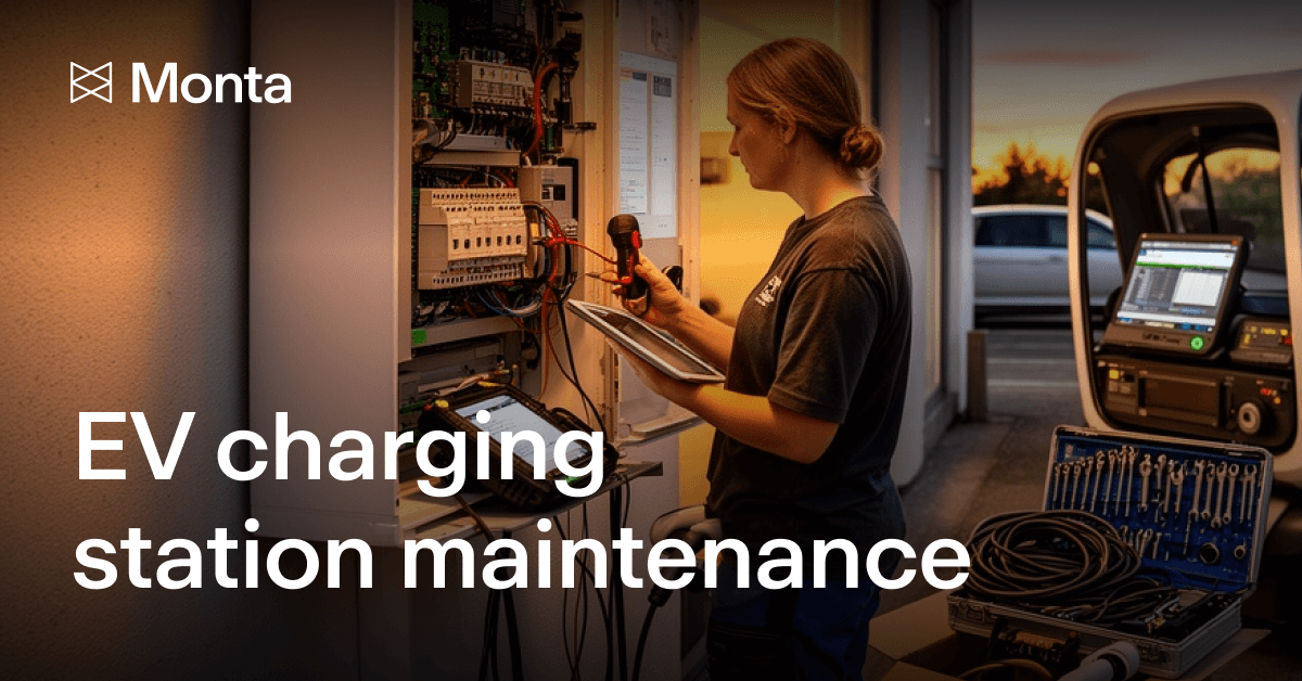 Technician servicing an electric vehicle charging station, with tools and equipment visible, under warm lighting.